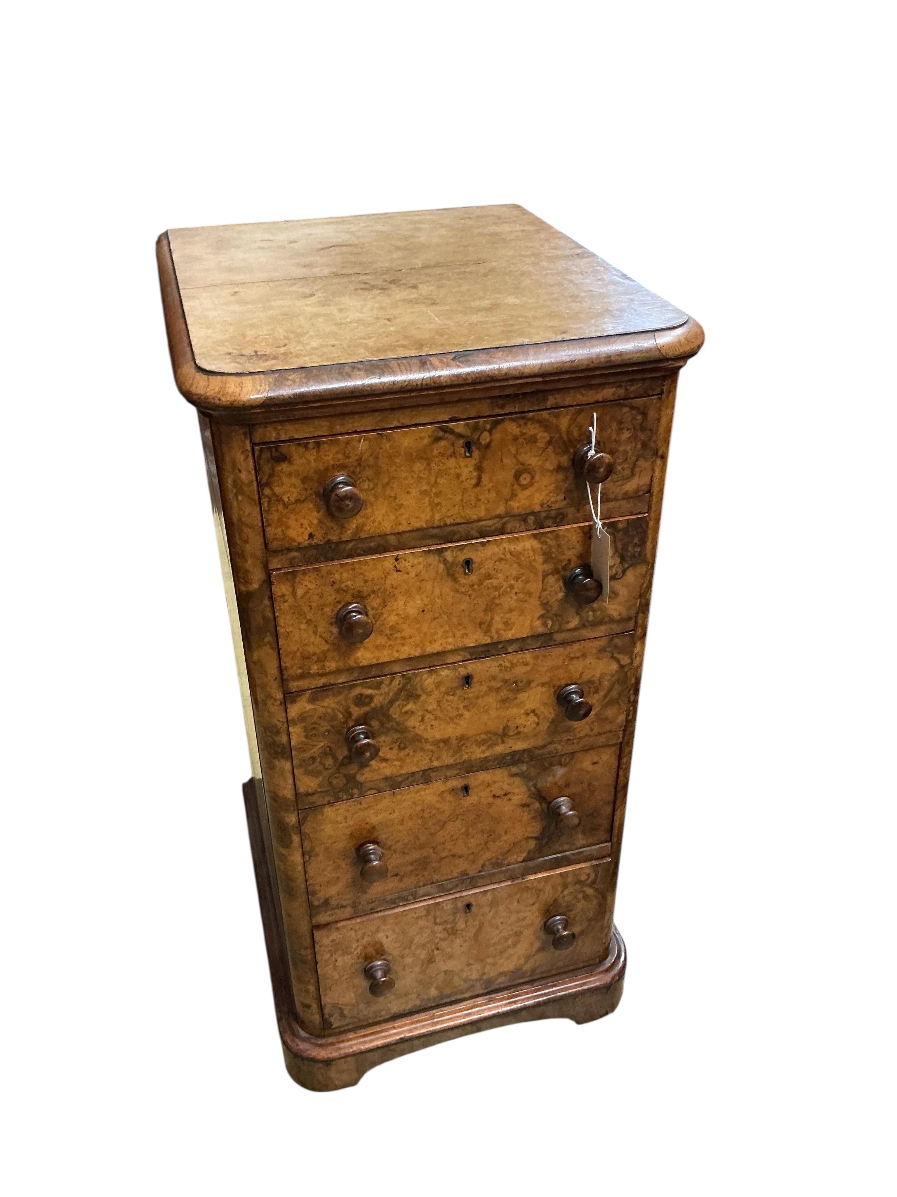 A pair of Victorian figured walnut five drawer bedside chests, adapted from a dressing table, width 43cm, depth 47cm, height 86cm